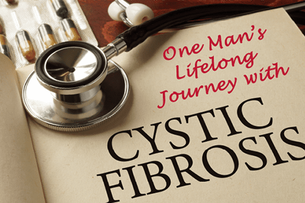 Book titled "One Man's Lifelong Journey with Cystic Fibrosis" sitting on a desk beside a stethoscope and sleeve of pills.