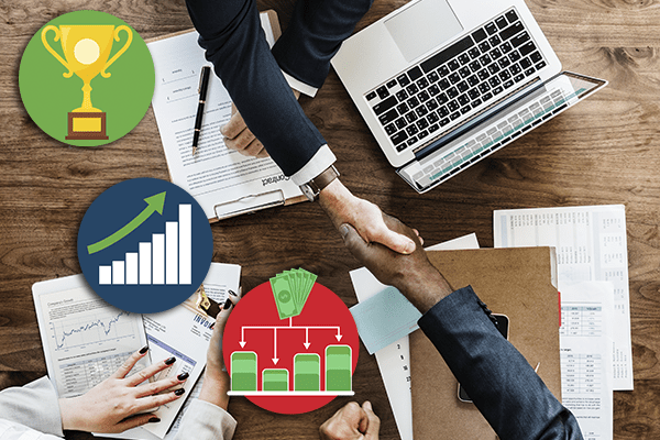 Handshake across table during a business meeting