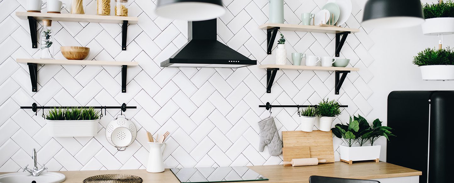 Big white kitchen backsplash with open shelves.