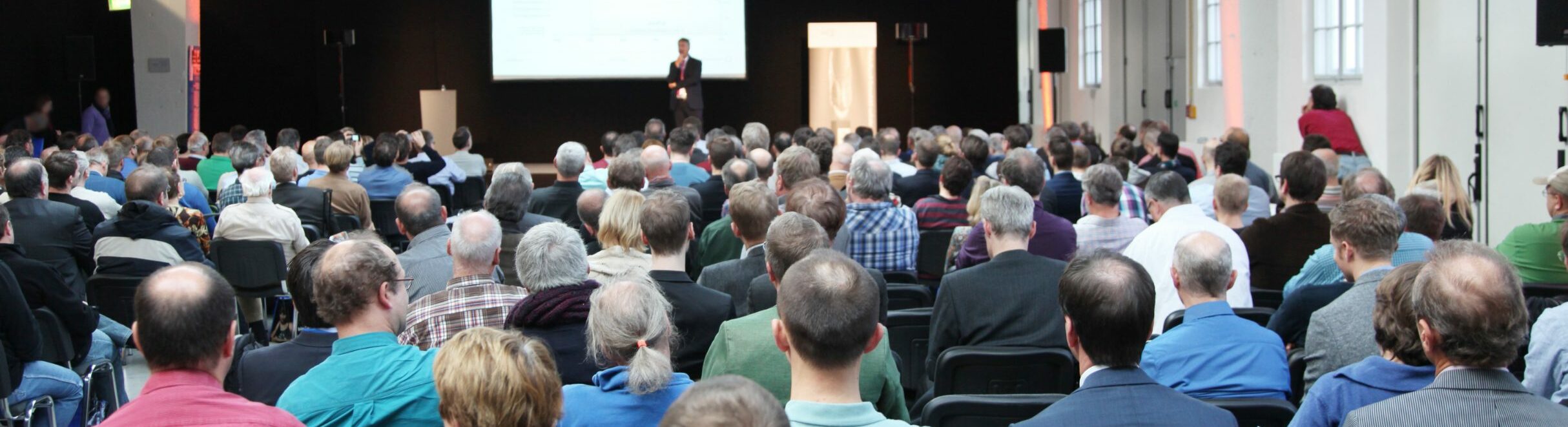 Attendees at conference presentation.