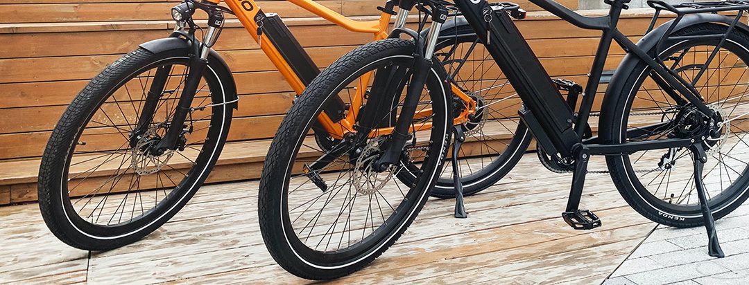 Two bikes resting on kickstands.