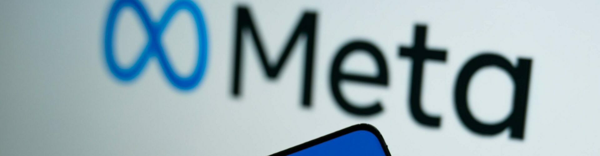 Bangkok, Thailand - October 29, 2021: Meta logo is shown on a device screen. Meta is the new corporate name of Facebook. Social media platform will change to Meta to emphasize its metaverse vision.