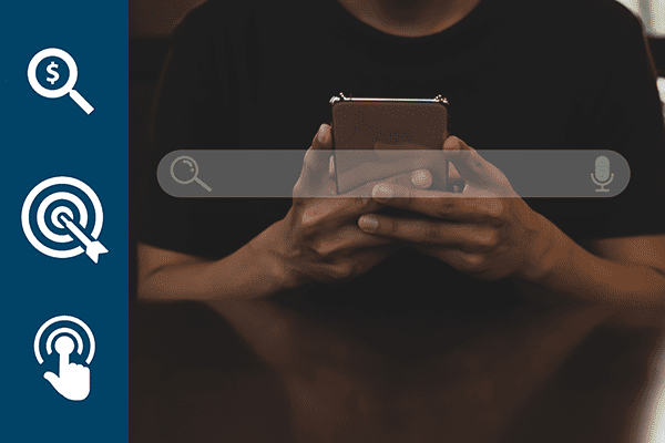 Young asian man wearing black t-shirt sitting on desk hand holding smartphone to Searching for information. Using Search Console with your website.