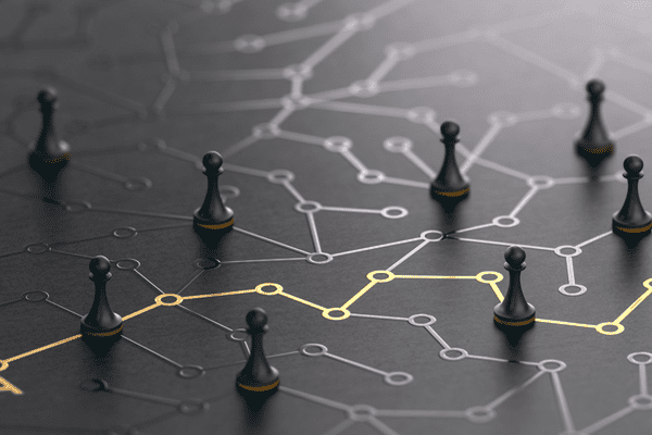 Chess pieces on a board with lines connecting to each other.