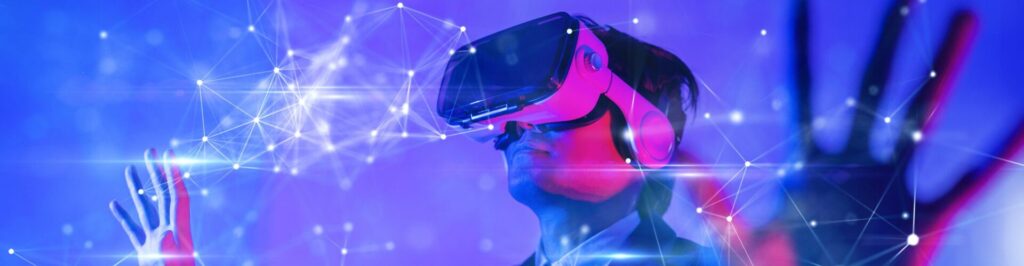 Person using VR headshot with the hands up. Purple, blue, and pink futuristic background.