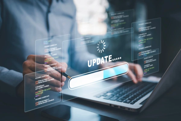 Man using laptop with Update loading bar for Google algorithm