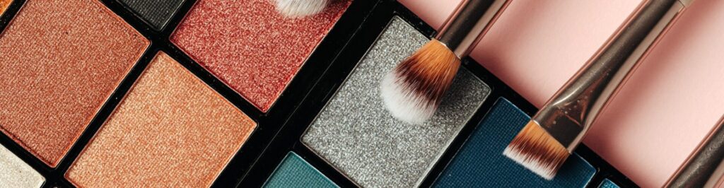 Make-up palette and brushes. Professional eyeshadow palette. Close up.