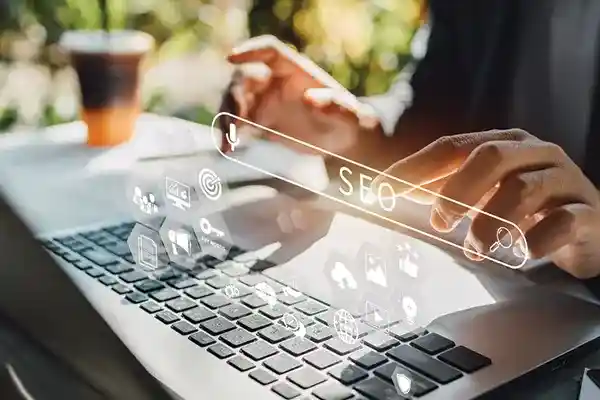 Person typing on laptop searching for something.