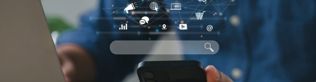 Person holding mobile phone with search bar on top of it and marketing icons.