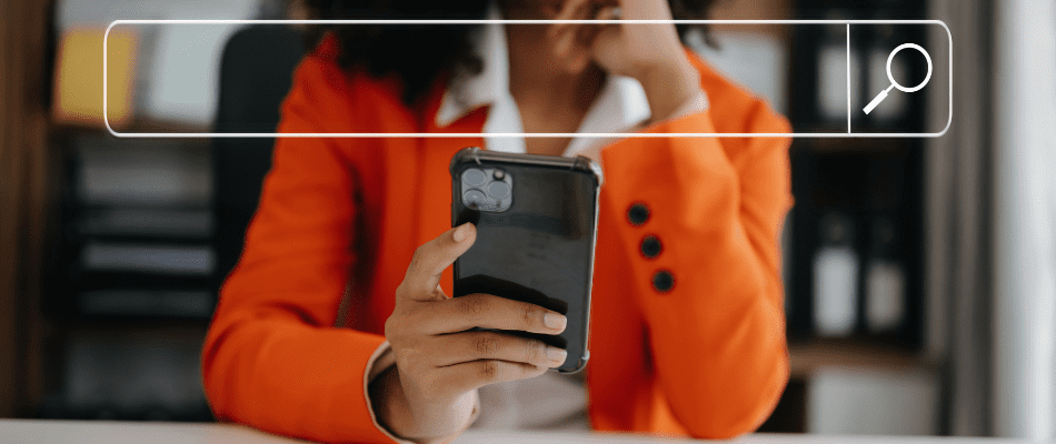 business woman holding phone making seo decisions for website