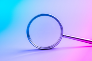 Magnifying glass on futuristic gradient background symbolizing searching tool, research, discovery, technology trends, analysis, data exploration, and innovation for modern digital business concepts.