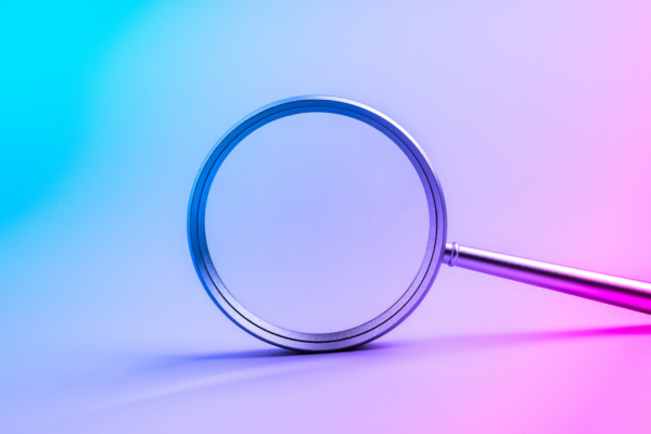 Magnifying glass on futuristic gradient background symbolizing searching tool, research, discovery, technology trends, analysis, data exploration, and innovation for modern digital business concepts.